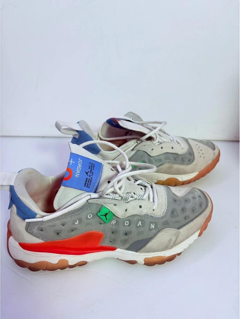 Jordan React white gray sneakers with orange outsole